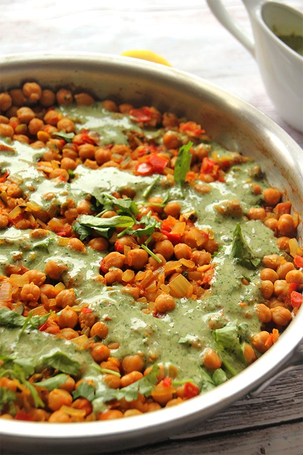 Chana masala with chickpeas topped with coriander coconut cream.