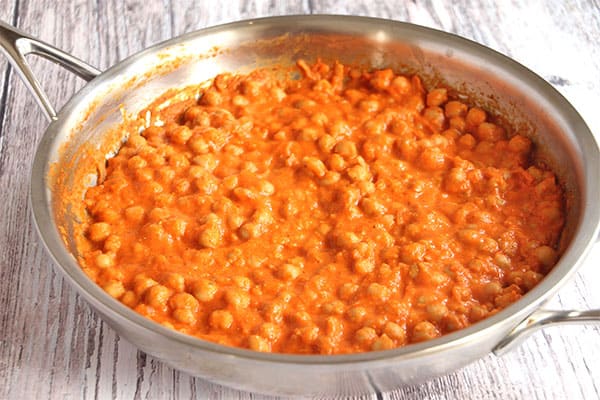 Chickpeas with Romesco sauce in stainless steel skillet