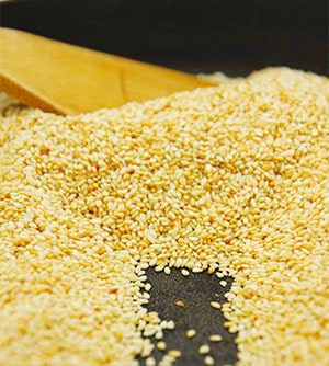 Sesame seeds are toasted in skillet.