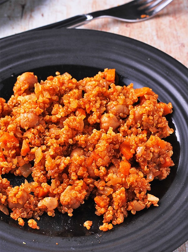 quinoa chickpea pilaf on black plate
