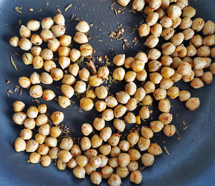 Chickpeas are sauteed with rosemary, black pepper and red chili flakes.