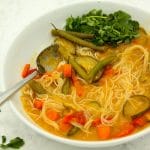 Thai red curry paste with noodles in white bowl