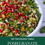 Pomegranate couscous salad with pearl couscous, fresh parsley, mint and pistachios in white bowl with text overlay of recipe title.