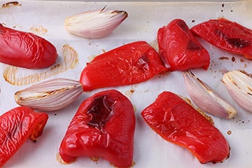 roasted red pepper and shallots on parchment paper