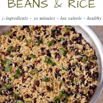 rice and beans with chopped cilantro in skillet