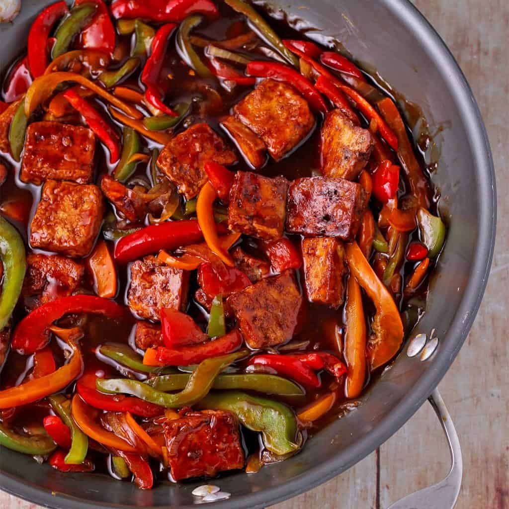 Wok with sweet and sour tofu, peppers and onions