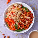 buffalo chickpea and rice bowl in with spinach and carrot sticks