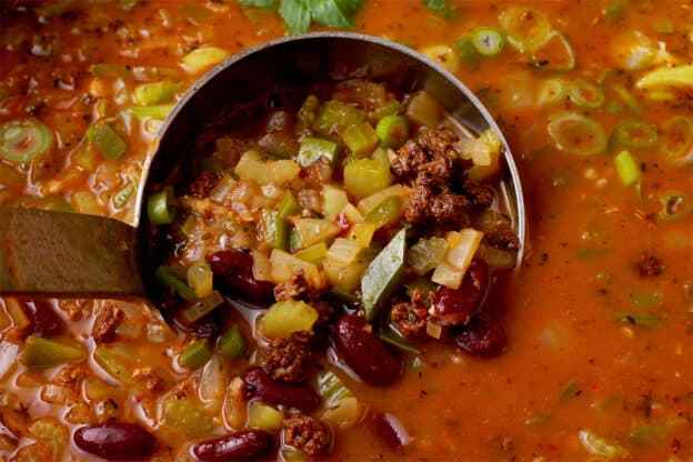 Red beans are cooked with tofu sausage crumbles in a broth.