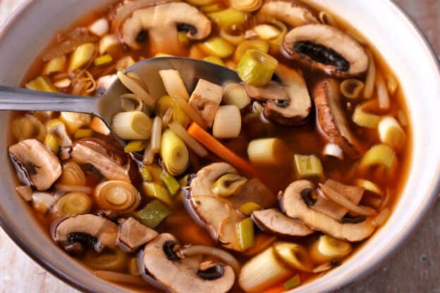 Hot and sour soup in a bowl with a spoon.