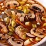 Hot and sour soup in a bowl with a spoon.