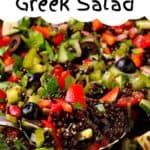 A spoonful of black lentil Greek salad.