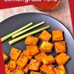 Baked tofu squares with lemon grass on a black plate with text overlay.