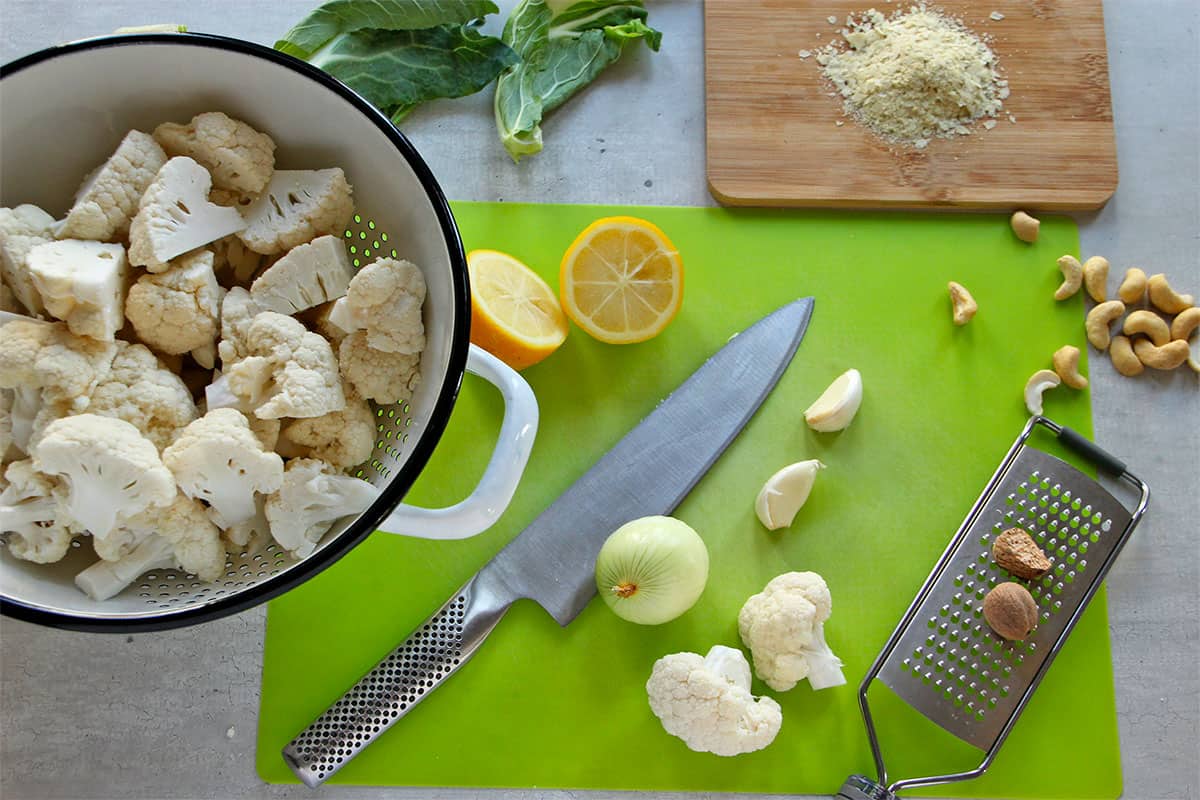 The ingredients for making cauliflower, cashew white sauce are gathered.