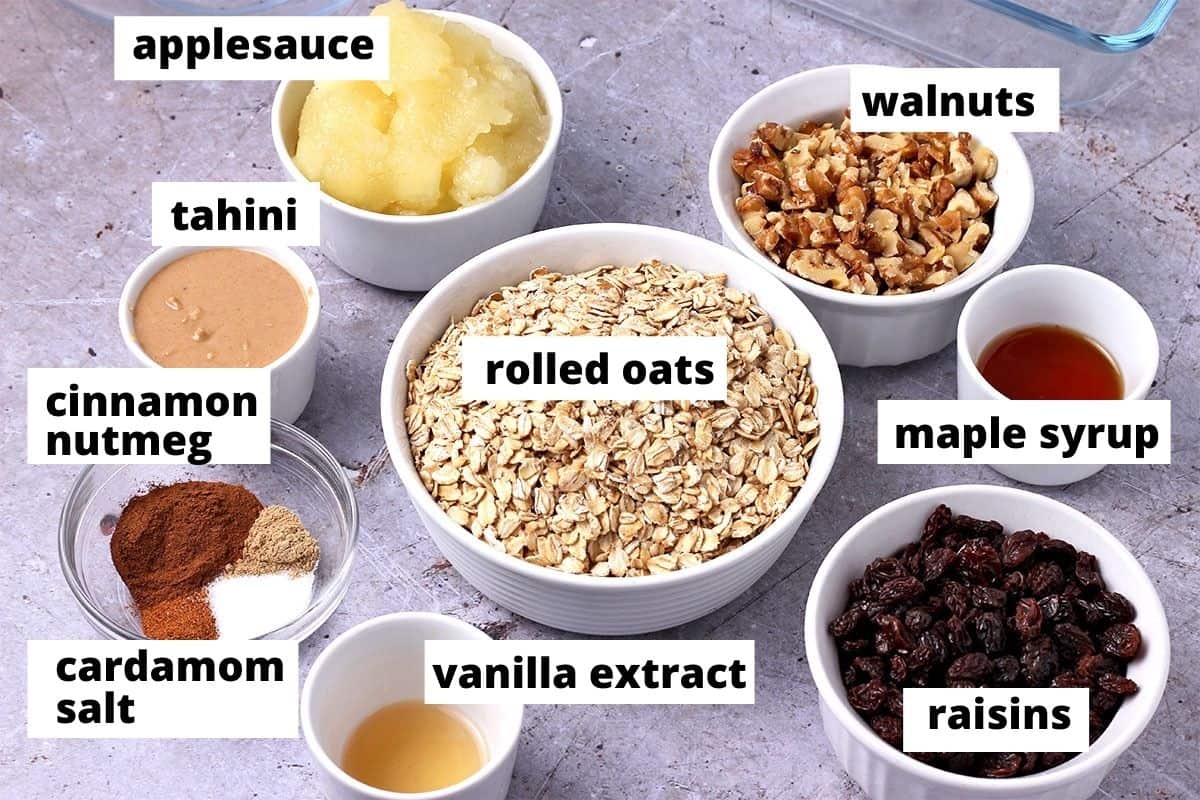 11 ingredients for oatmeal raisin breakfast bars are laid out. 